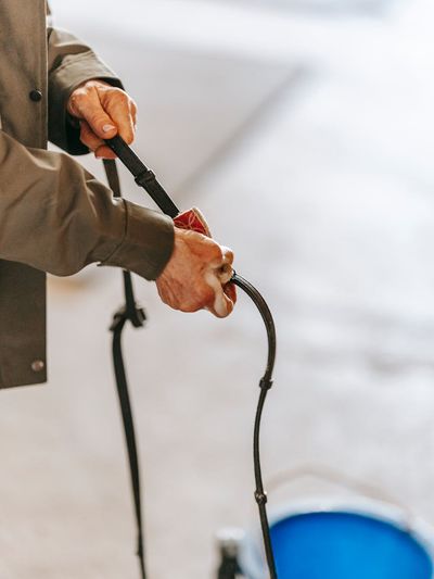 Close-up on a man's hands in a stable position on a mat.